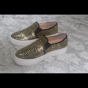 Vince Camuto black and gold sneakers